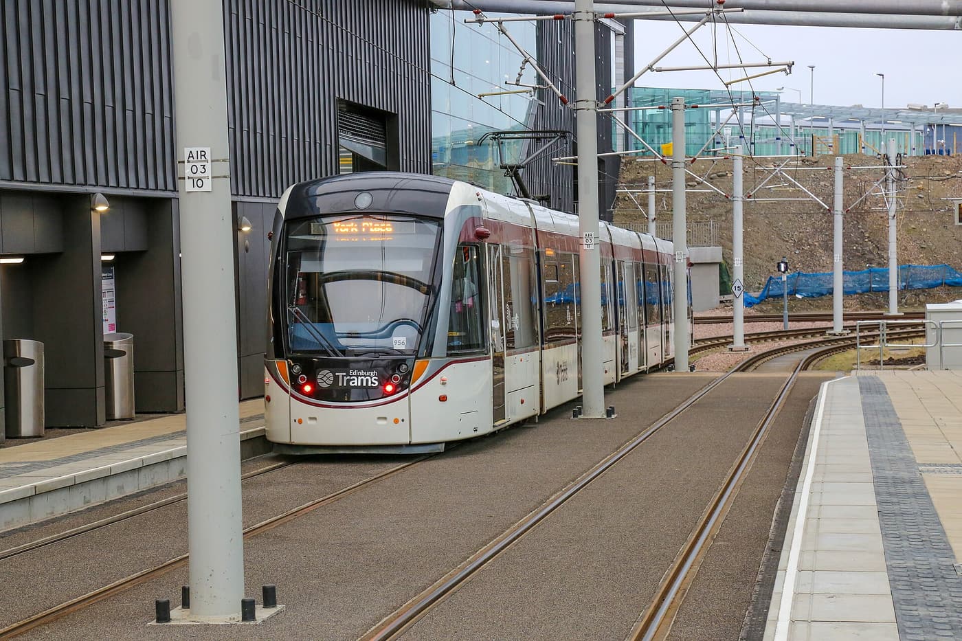 An Edinburgh tram at a stop on the airport line